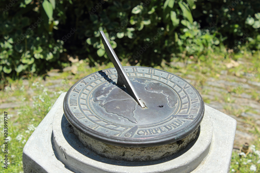 old sun clock in a garden