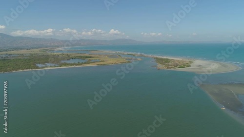 Aerial view of sandy beach Lingayen with azure water on the island Luzon, Philippines. Seascape, ocean and beautiful beach. photo