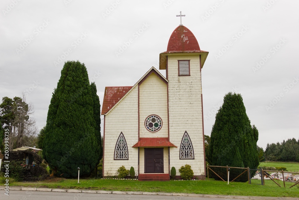 Santa Cruz Chapel on cloudy day in Puerto Varas, South Chile. Catholic religion concept Santa Cruz Chapel on cloudy day in Puerto Varas, South Chile. Catholic religion concept