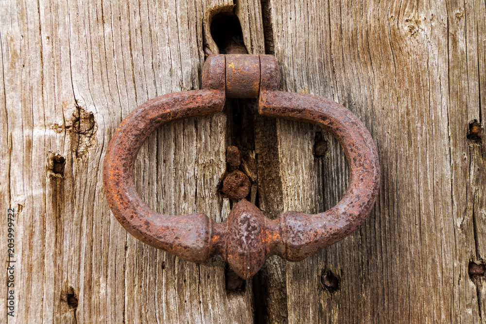 An ancient handmade door bell, A knock at the door, a wooden door An ancient handmade door bell, A knock at the door, a wooden door