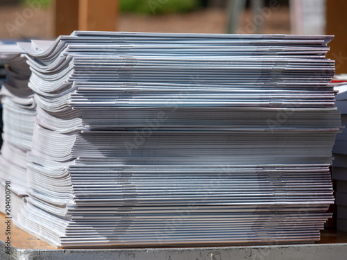 Stack of stapled periodicals sitting in a stack
