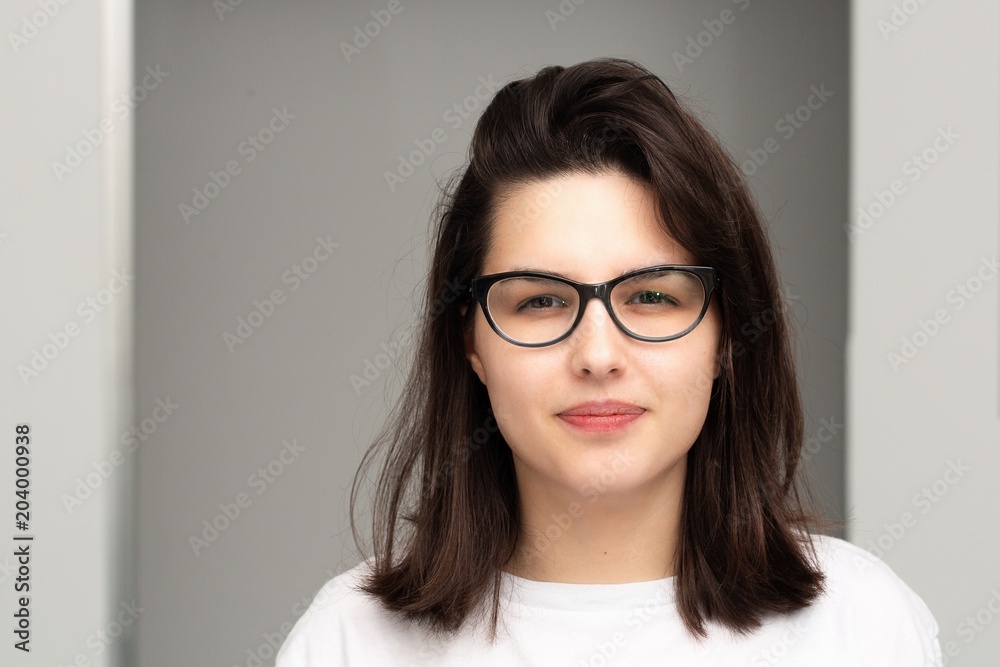Short sighted girl with glasses Stock Photo | Adobe Stock