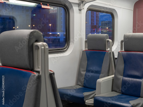 Pair of commuter train seats in the early morning