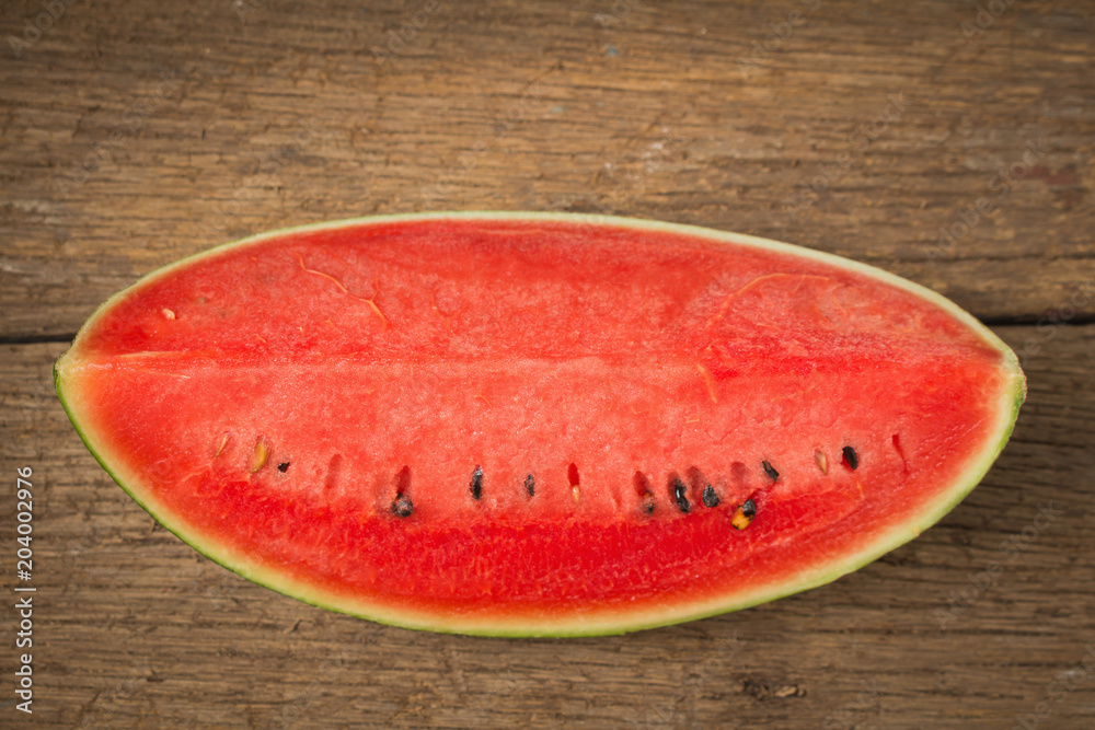 slice of ripe watermelon on old wood