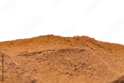 Ground Cinnamon on a White Background