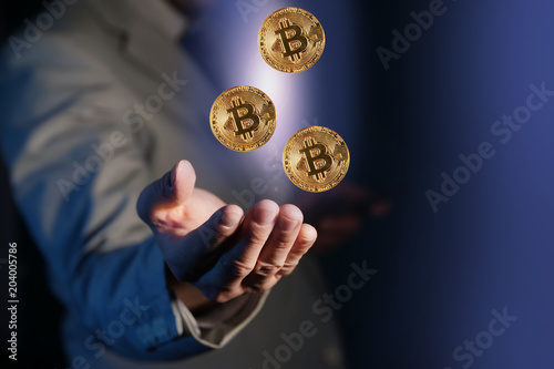 close-up of bitcoin in hand