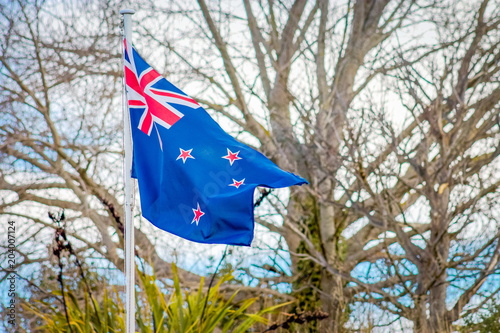 Close up image of a New Zealand flag blowing in the wind