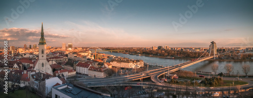 Cityscape of Bratislava, Slovakia with St. Martin's Cathedral and Danube River with New Bridge at Sunset