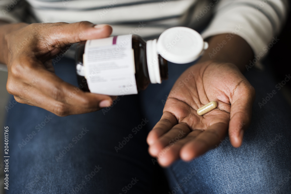 Woman taking pills for her health