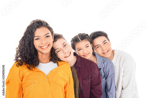 portrait of cheerful multicultural teen friends leaning on each other isolated on white © LIGHTFIELD STUDIOS