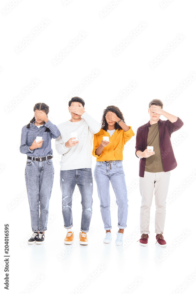 obscured view of teen friends with smartphones isolated on white obscured view of teen friends with smartphones isolated on white