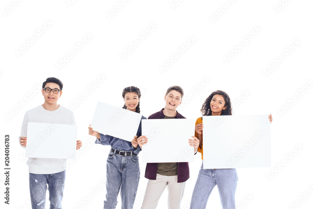 portrait of interracial teenagers holding blank banners in hands isolated on white portrait of interracial teenagers holding blank banners in hands isolated on white