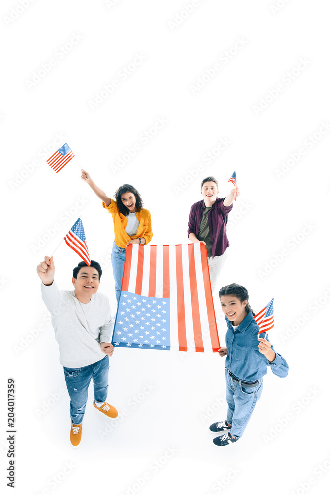 Fototapeta premium high angle view of group of multiethnic teens with usa flags isolated on white