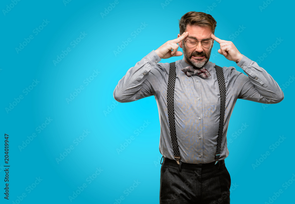 Middle age man, with beard and bow tie doubt expression, confuse and wonder concept, uncertain future Middle age man, with beard and bow tie doubt expression, confuse and wonder concept, uncertain future