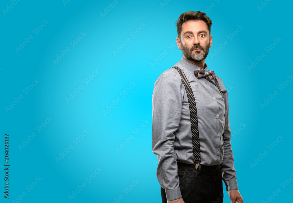 Middle age man, with beard and bow tie confident and happy with a big natural smile looking at camera Middle age man, with beard and bow tie confident and happy with a big natural smile looking at camera