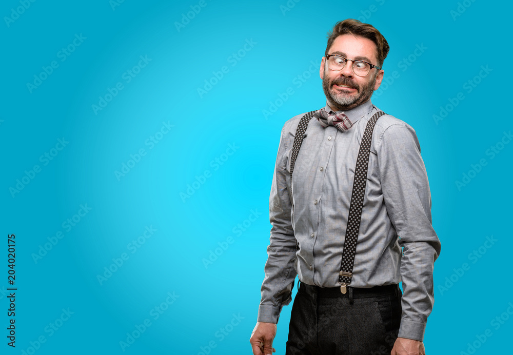 Middle age man, with beard and bow tie making funny face fooling Middle age man, with beard and bow tie making funny face fooling