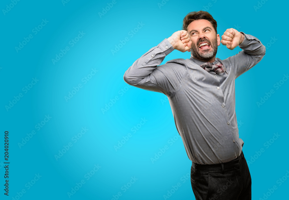 Middle age man, with beard and bow tie confident and happy with a big natural smile laughing Middle age man, with beard and bow tie confident and happy with a big natural smile laughing