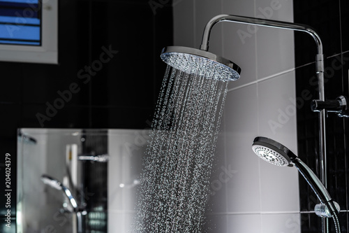 Close up of Water flowing from shower in the bathroom