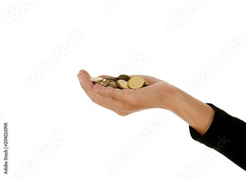 A female hand with coin isolated against a white background