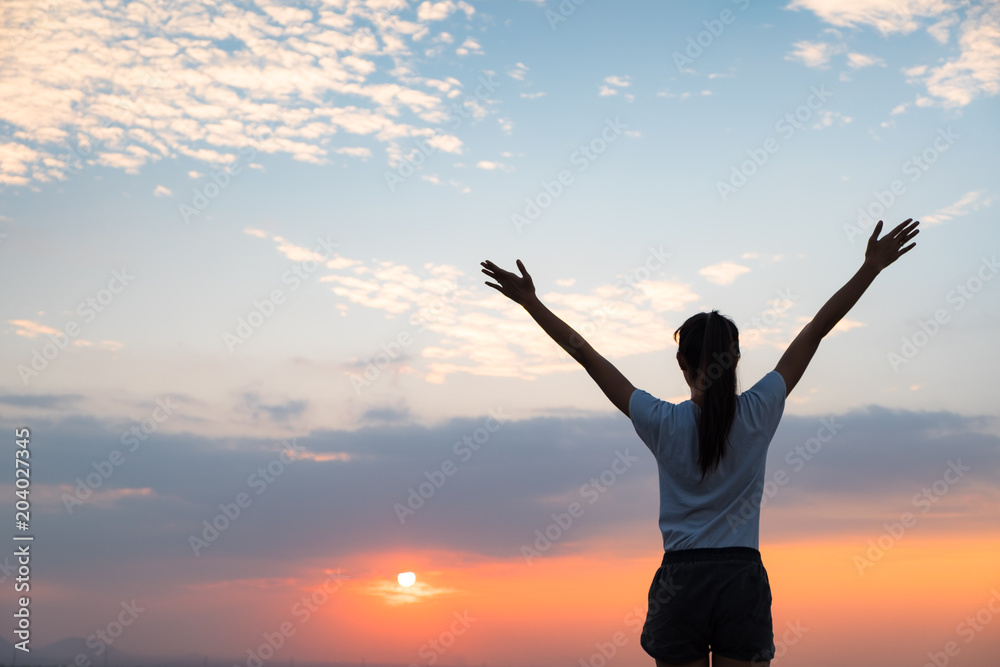 Young asian woman feeling free at sunset Young asian woman feeling free at sunset