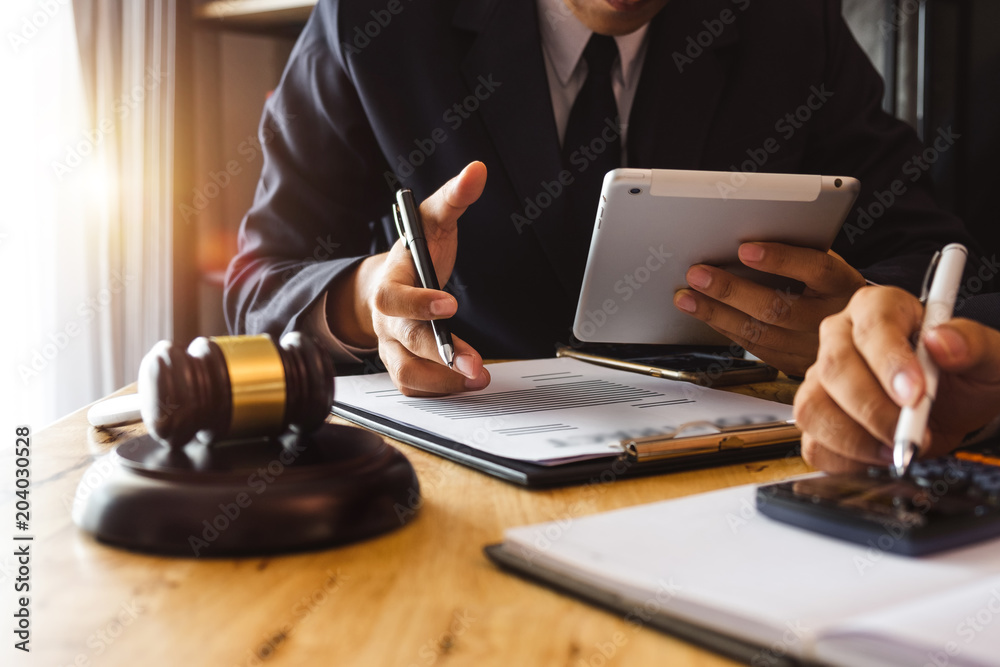 justice and law concept.Male judge in a courtroom the gavel,working with digital tablet computer on wood table in morning light
justice and law concept.Male judge in a courtroom the gavel,working with digital tablet computer on wood table in morning light