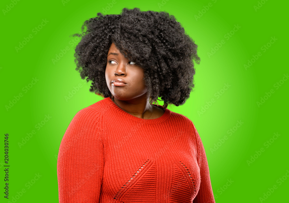 Beautiful african woman doubt expression, confuse and wonder concept, uncertain future Beautiful african woman doubt expression, confuse and wonder concept, uncertain future