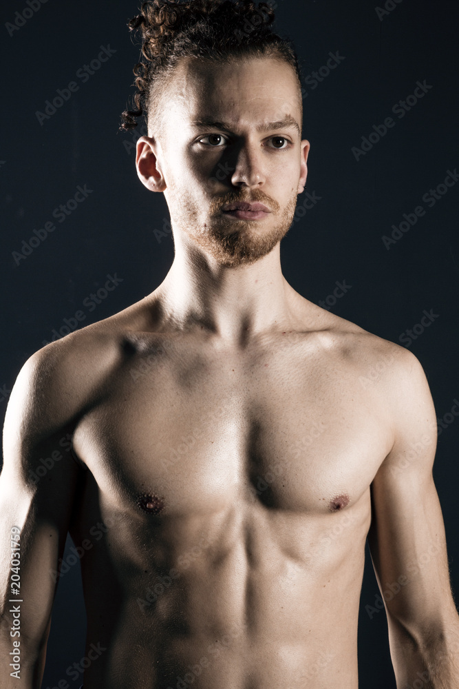 Young ginger topless man studio portrait Young ginger topless man studio portrait