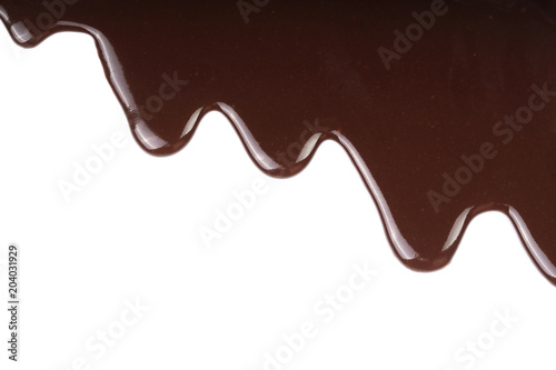 Melted chocolate dripping isolated on white background