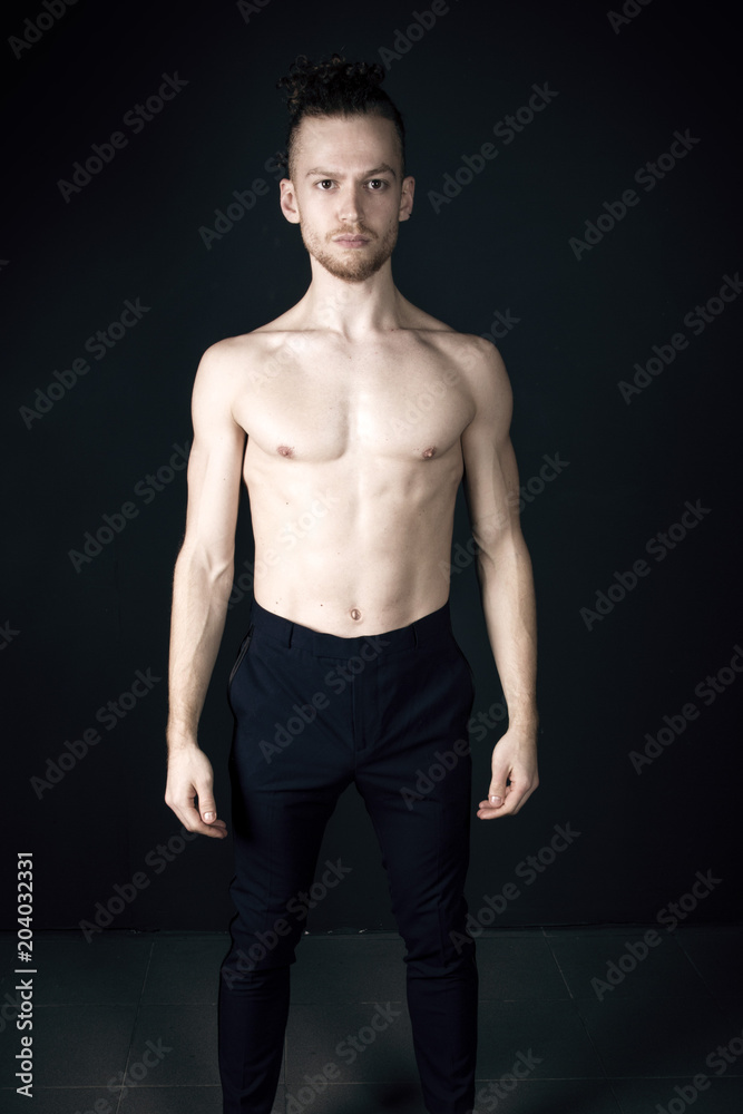 Young ginger topless man studio portrait Young ginger topless man studio portrait