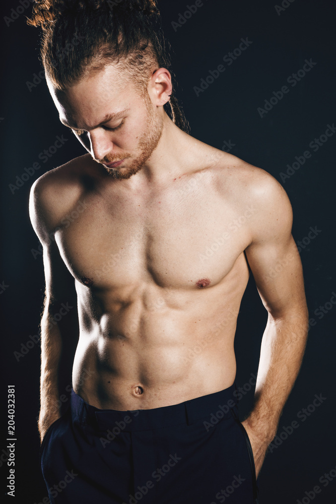 Young ginger topless man studio portrait