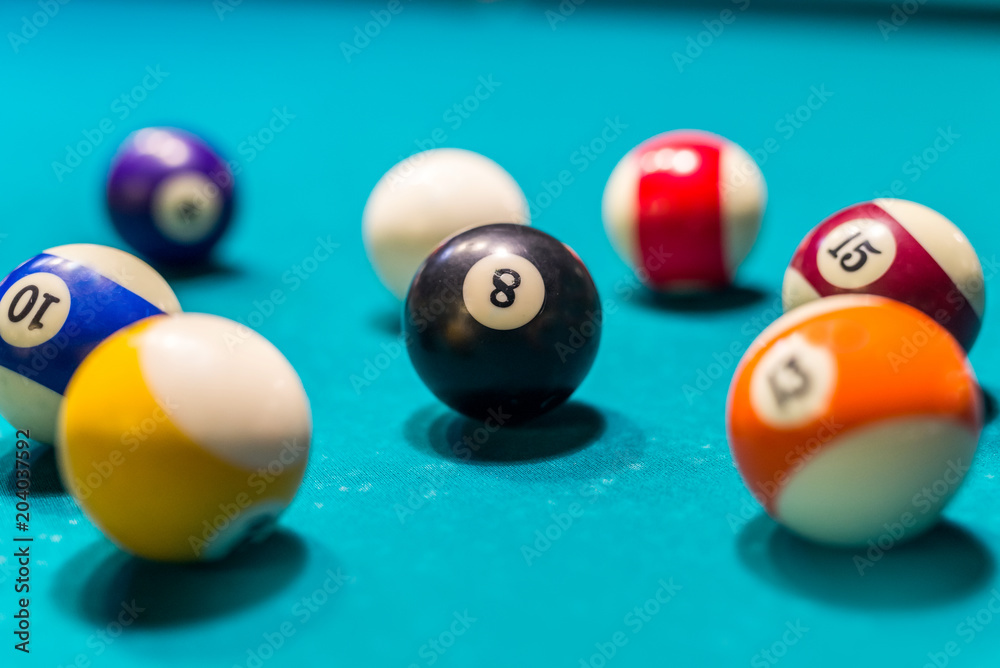 Billiard coloured balls on blue table background Billiard coloured balls on blue table background