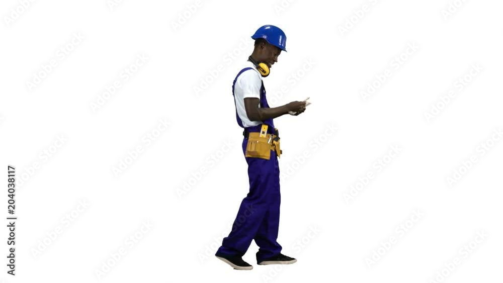 Builder of an African American finds money on the move. Alpha channel. Side view Builder of an African American finds money on the move. Alpha channel. Side view