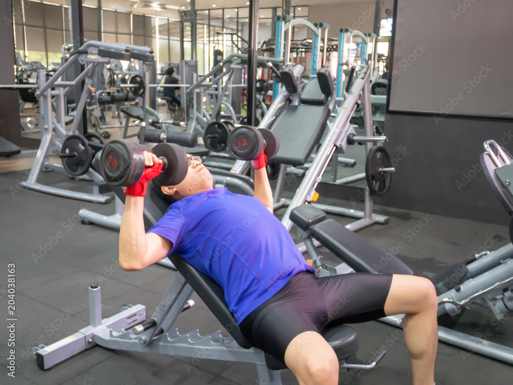 Training dumbbell in the gym