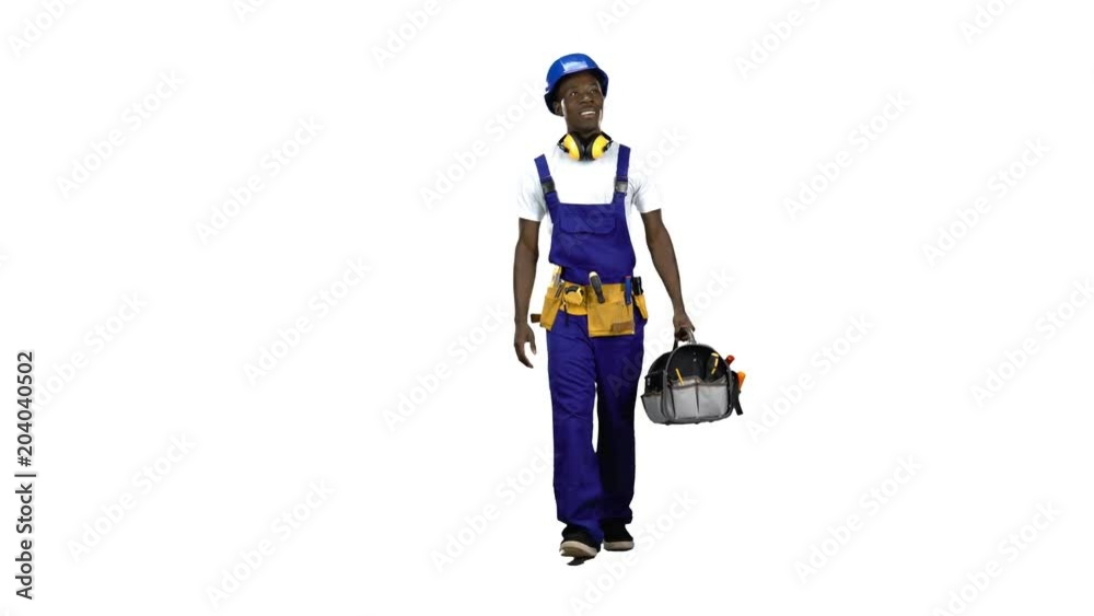 African American construction worker goes to work with a suitcase with tools . Alpha channel African American construction worker goes to work with a suitcase with tools . Alpha channel