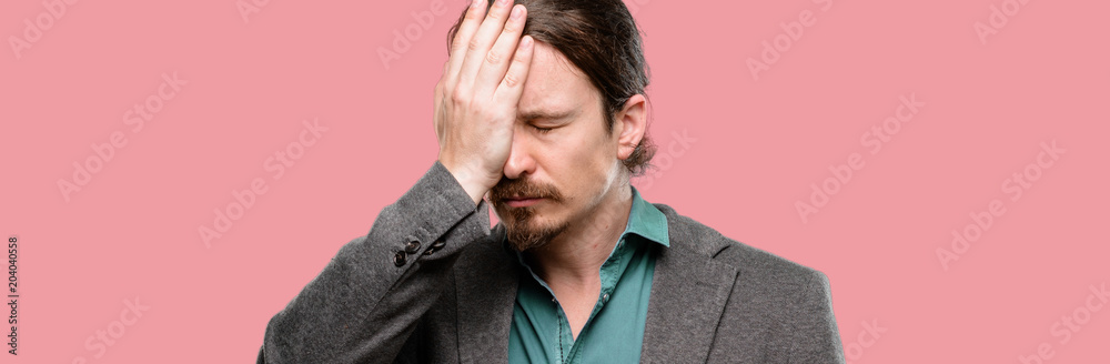 Handsome young man stressful keeping hand on head, tired and frustrated Handsome young man stressful keeping hand on head, tired and frustrated