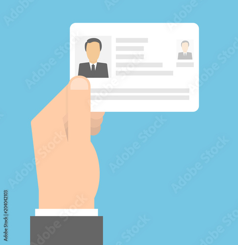 Hand holding identity card