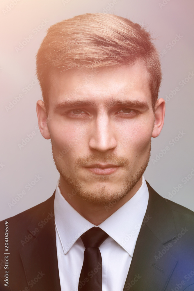 closeup face of a serious businessman. closeup face of a serious businessman.