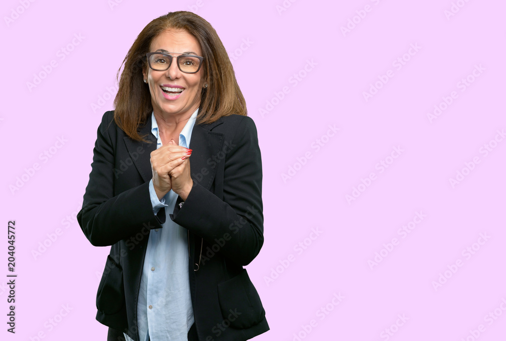 Middle age business woman confident and happy with a big natural smile Middle age business woman confident and happy with a big natural smile