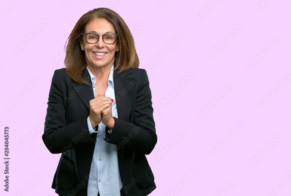 Middle age business woman confident and happy with a big natural smile Middle age business woman confident and happy with a big natural smile