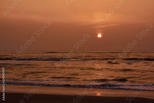 Sunset and reflection of the sun at the north sea  Netherlands