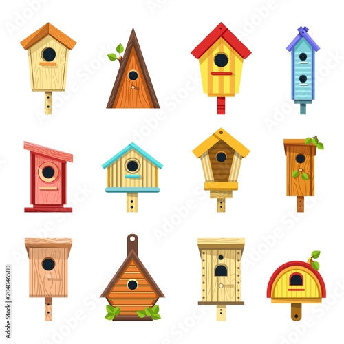 Foto Wooden birdhouses of creative design to hang on tree set