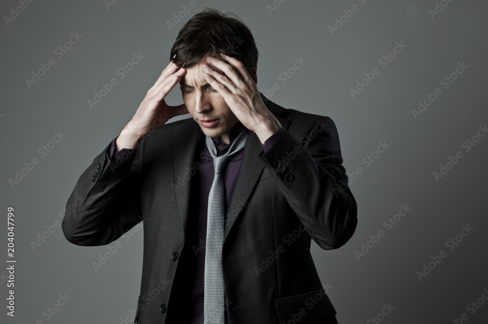 Businessman with a problem on his mind Businessman with a problem on his mind