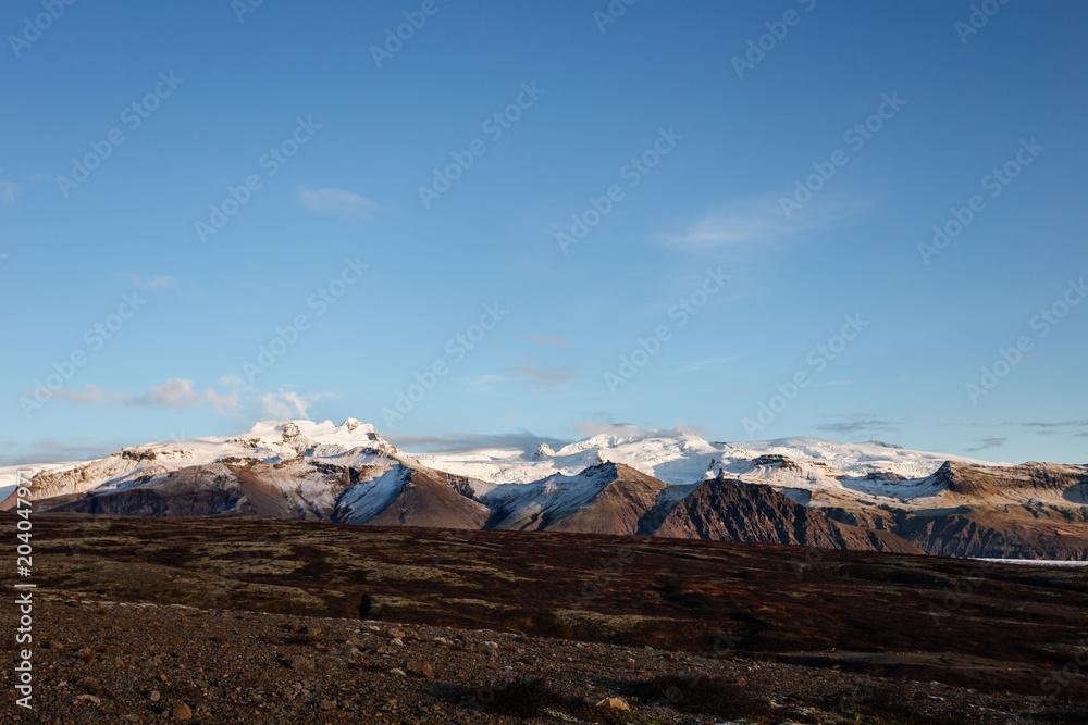 Volcanic landscape with mountains near glacier, South Iceland