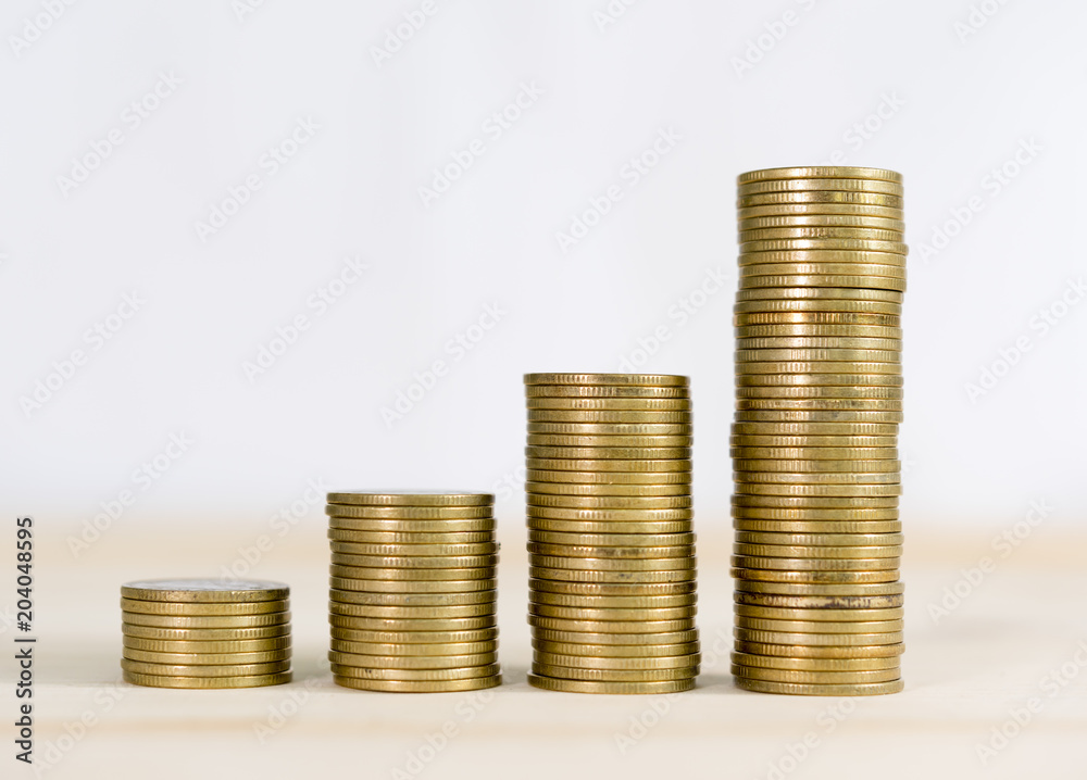 Coin money stacks on a white background.Business concept. Coin money stacks on a white background.Business concept.