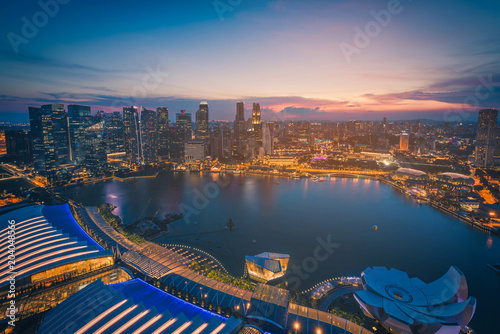 Photography Singapore Skyline and view of skyscrapers on Marina Bay at sunset
