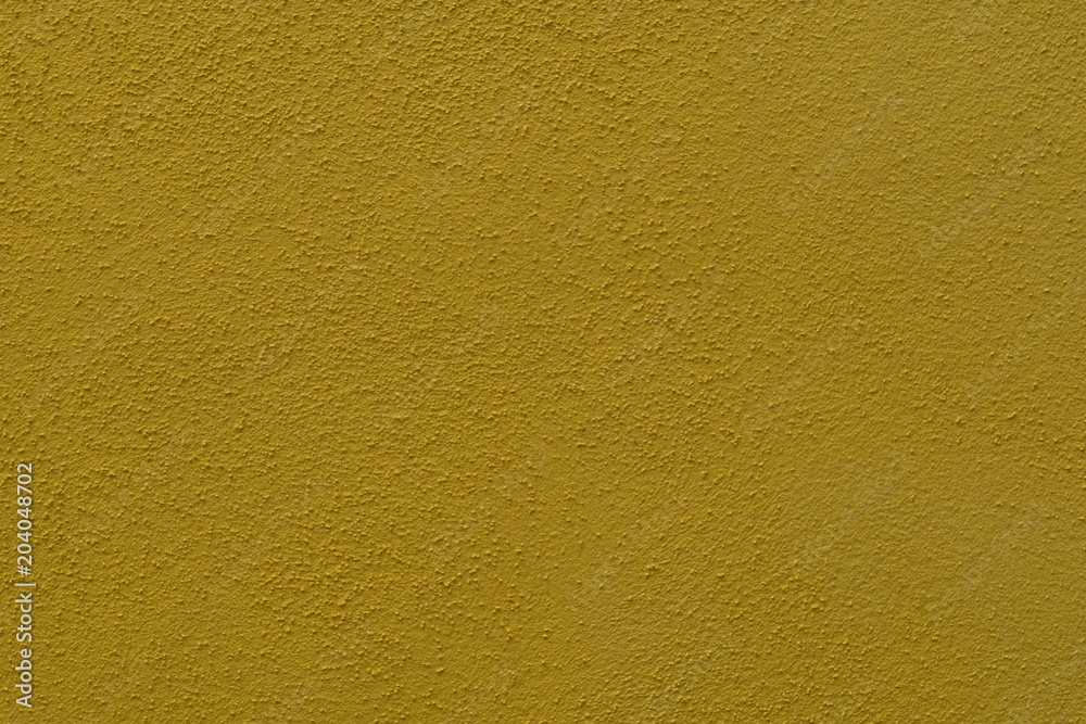 Fototapeta premium dark yellow cement wall with fine structure - detail