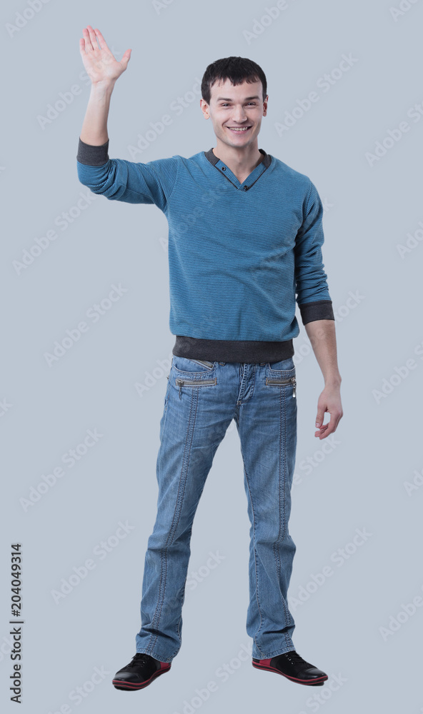 Young happy casual man portrait, isolated on gray background Young happy casual man portrait, isolated on gray background