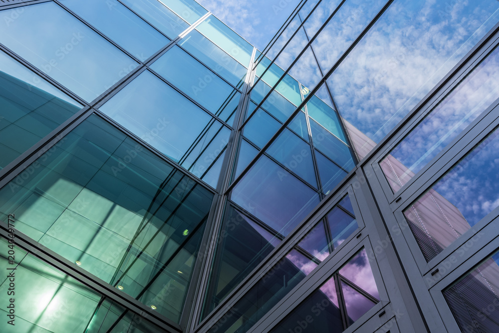The glass architecture in city against a sky