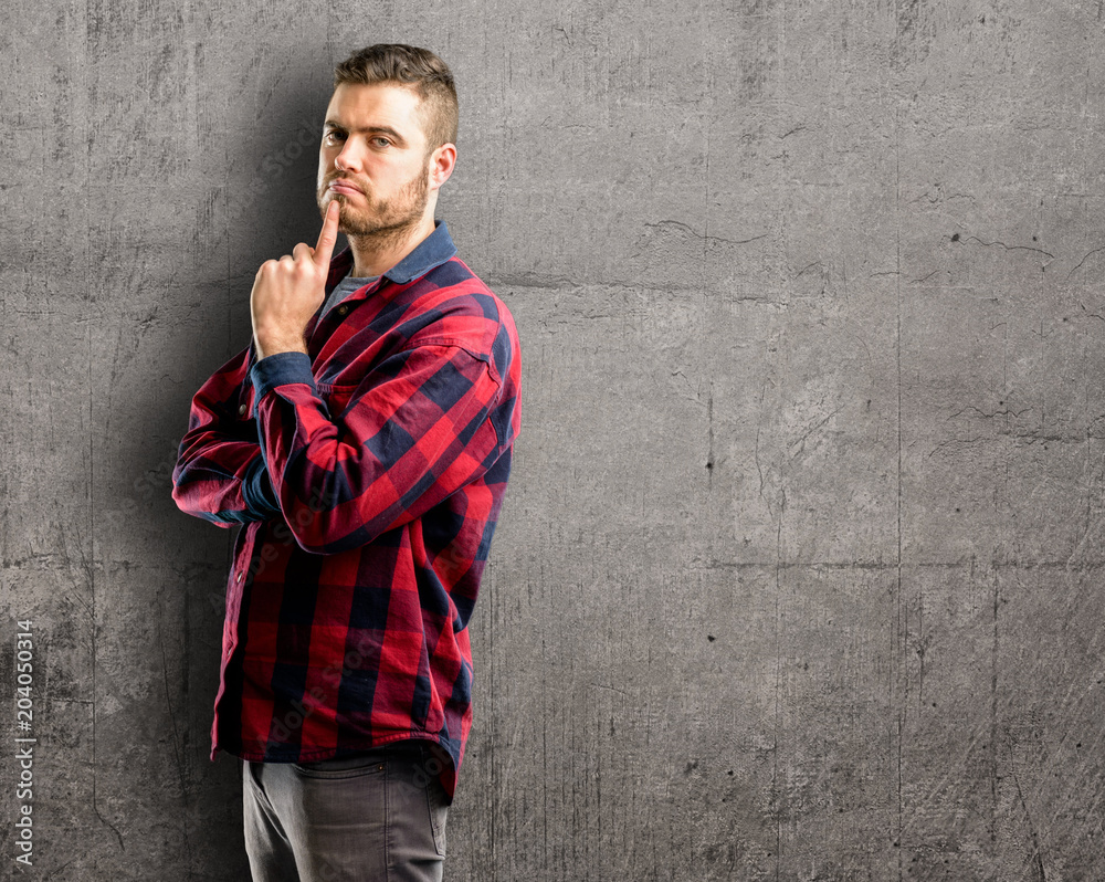Obraz premium Young handsome man thinking thoughtful with smart face