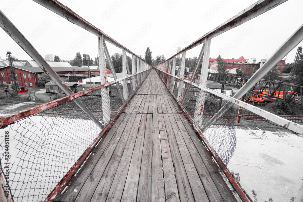Old wooden bridge above abandoned train station Old wooden bridge above abandoned train station